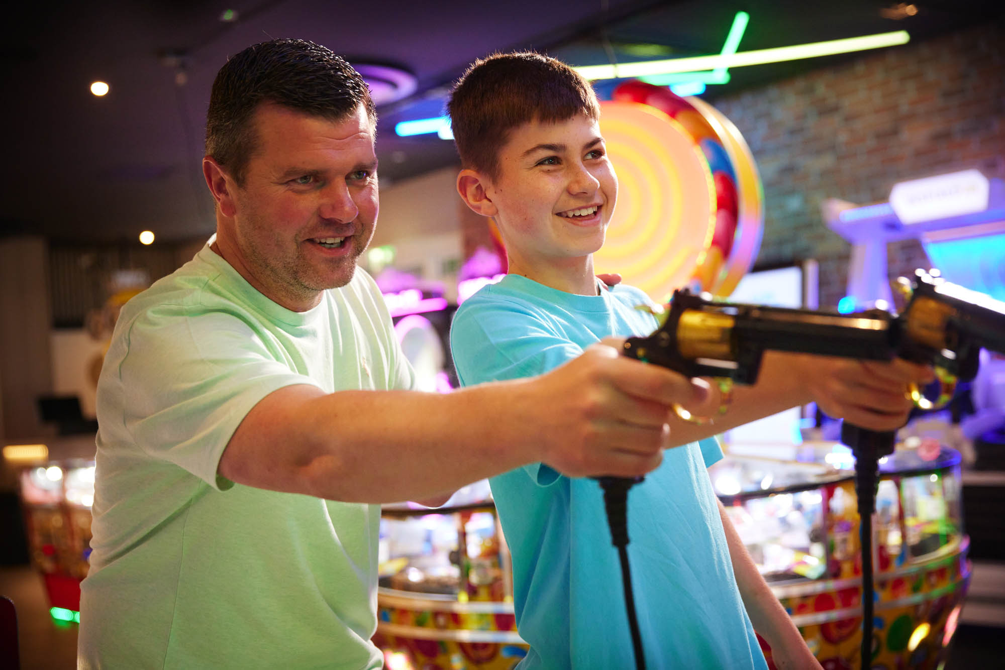Boy and Father on shooting game