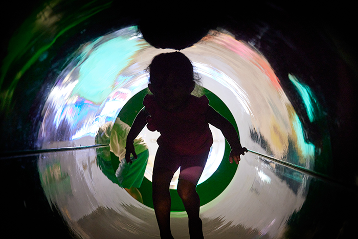 small girl in tunnel soft play