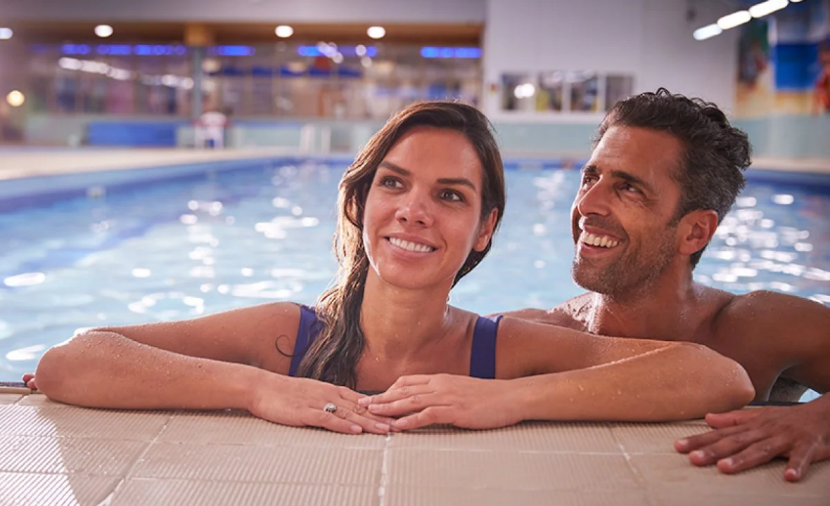Couple relaxing in a swimming pool