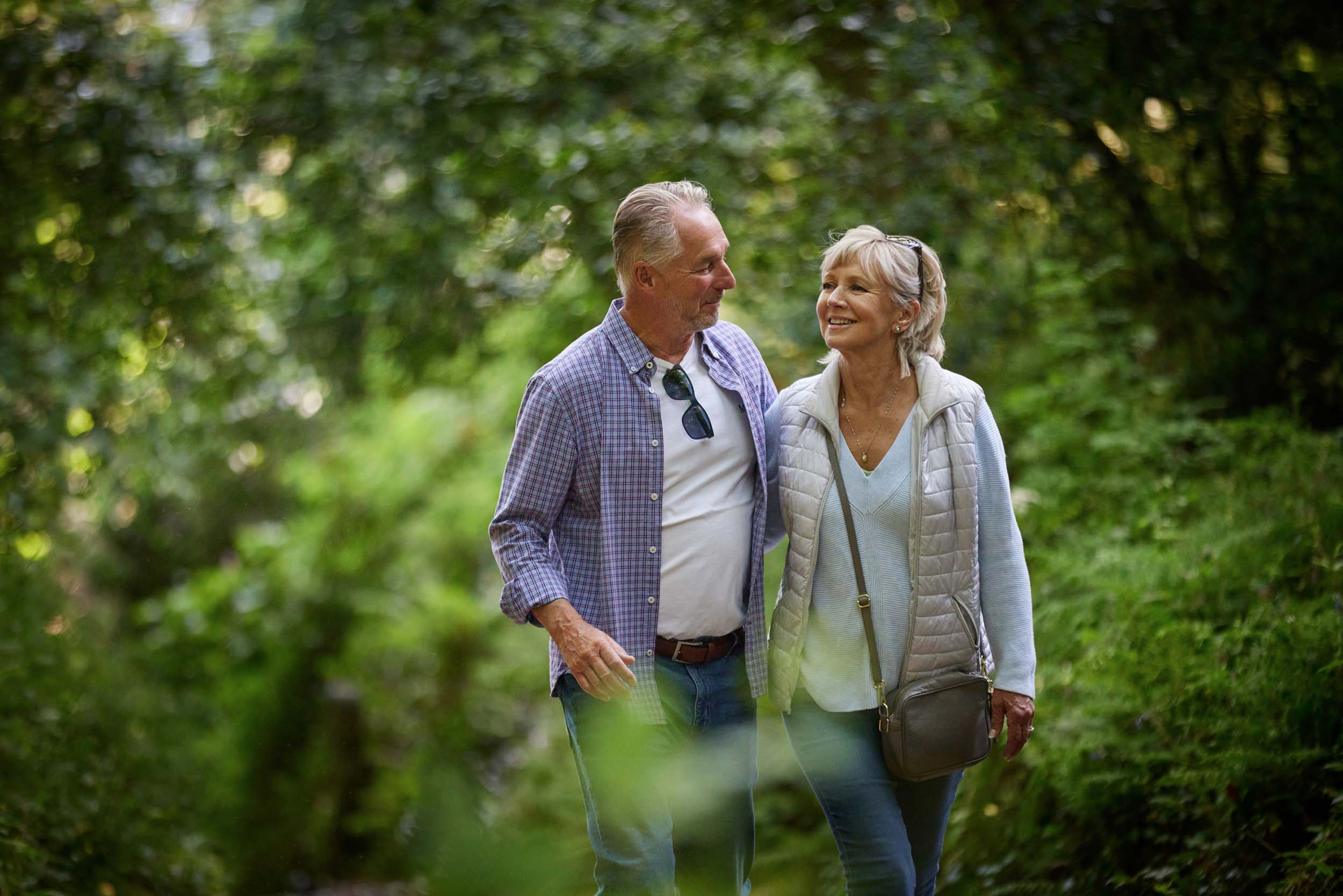 older-couple-walk-in-the-woods