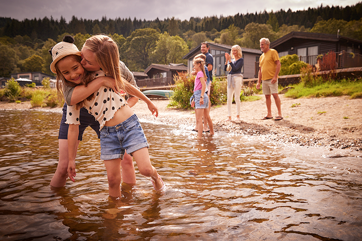 Family playing in Loch Lomond