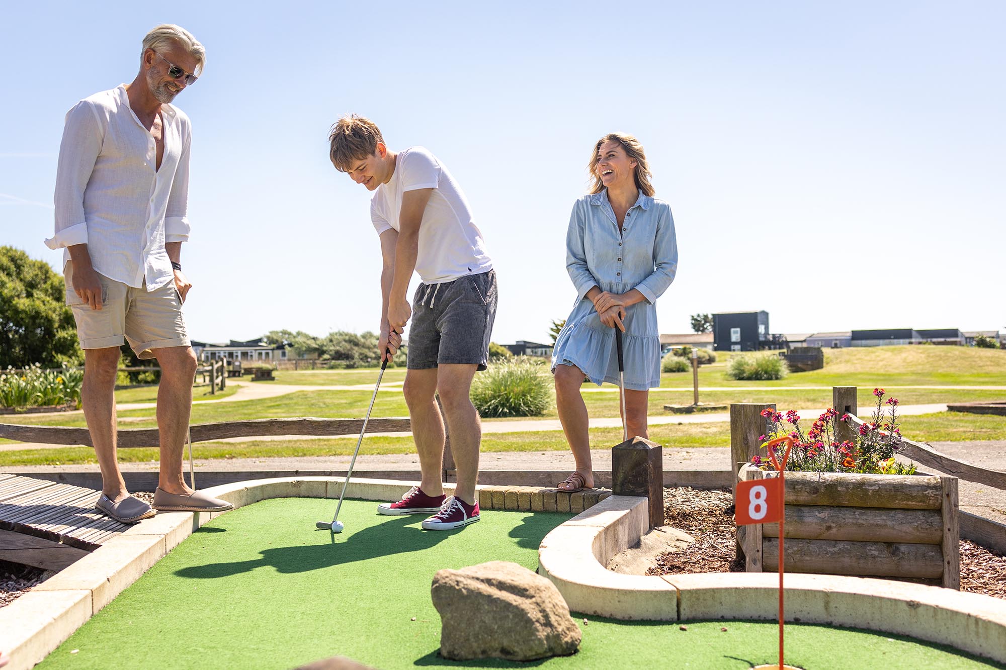 family play a game of crazy golf